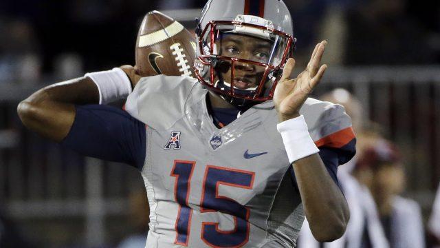 Connecticut quarterback Donovan Williams passes the ball during the first half of the team's NCAA college football game against Temple, Friday, Nov. 4, 2016, in East Hartford, Conn. (AP Photo/Elise Amendola)