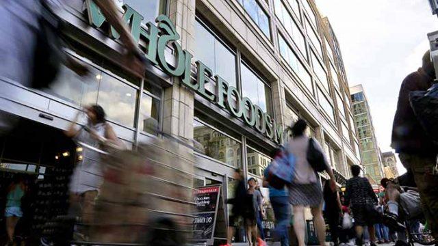 FILE - In this Wednesday, June 24, 2015, file photo, pedestrians pass in front of a Whole Foods Market store in Union Square, in New York. On Wednesday, Nov. 2, 2016, Whole Foods Market Inc. reports financial results. (AP Photo/Julie Jacobson, File)
