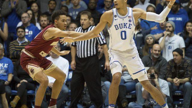 Duke's Jayson Tatum (0) backs down Boston College's A.J. Turner (11) during the first half of an NCAA college basketball game in Durham, N.C., Saturday, Jan. 7, 2017. Duke defeated Boston College 93-82. (AP Photo/Ben McKeown)