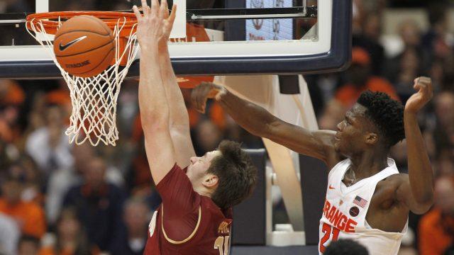 Syracuse's Tyler Roberson, right, blocks the shot by Boston College's Nik Popovic, left, in the second half of an NCAA college basketball game in Syracuse, N.Y., Saturday, Jan. 14, 2017. Syracuse won 76-53. (AP Photo/Nick Lisi)