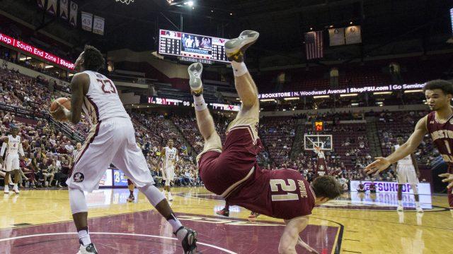 Boston College forward Nik Popovic, center, is called for a foul as he tried to block Florida State forward Jarquez Smith's shot in the second half of an NCAA college basketball game in Tallahassee, Fla., Monday, Feb. 20, 2017. Florida State defeated Boston College 104-72. (AP Photo/Mark Wallheiser)