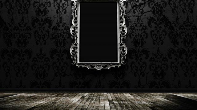 a beautiful vintage mirror in a dark room