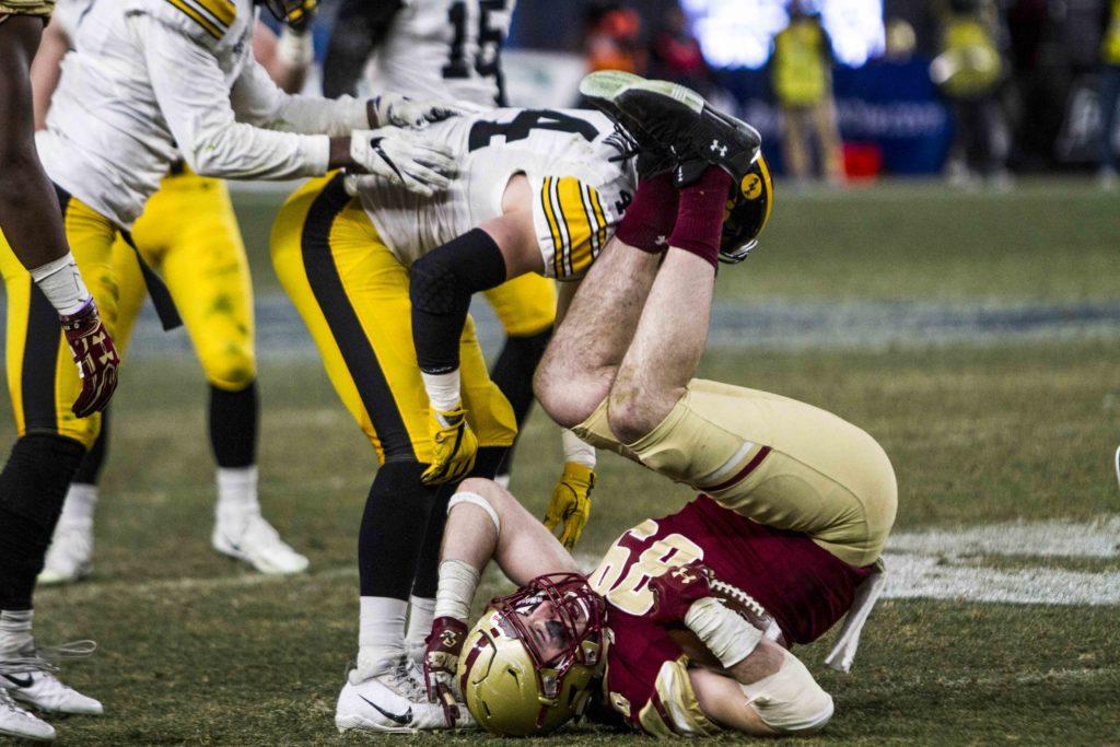 TE Tommy Sweeney is upended during the second half of Wednesday's game.