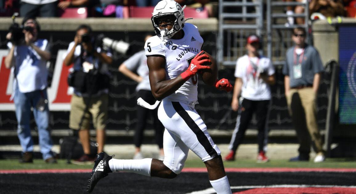 Louisville wide receiver Seth Dawkins (5) looks back over his shoulder as he scores a touchdown during the first half of an NCAA college football game in Louisville, Ky., Saturday, Oct. 5, 2019. (AP Photo/Timothy D. Easley)