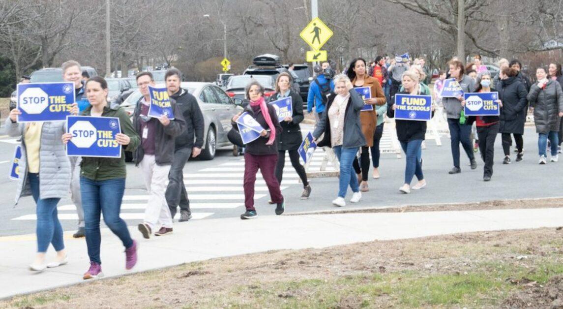 Protests rallying against potential job cuts at Newton Public Schools on March 31. (Julia Remick/Heights Editor) 