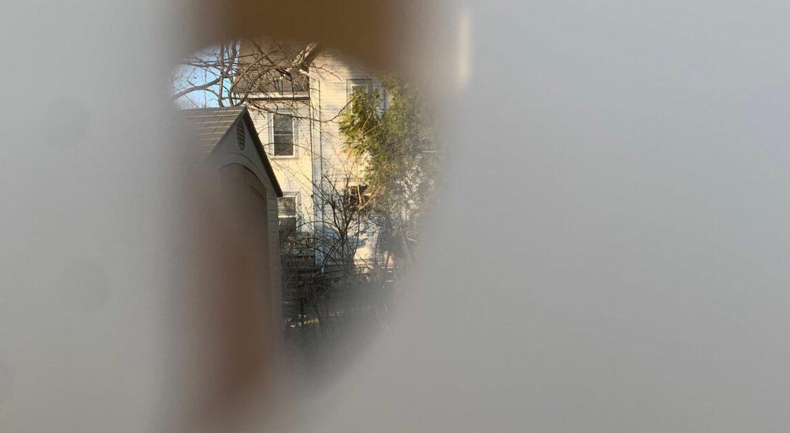 Jackalyn Schrader said the neighbor shot a hole through her fence.