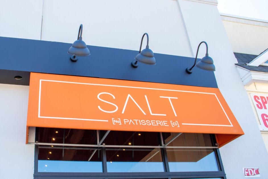 With its burnt orange awning and sleek interior, Salt Patisserie stands out among the plethora of bakeries and coffee shops in Newton Centre (MC Claverie / Heights Editor).