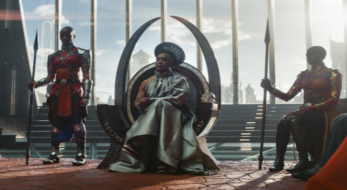 (L-R): Dorothy Steel as Merchant Tribe Elder, Florence Kasumba as Ayo, Angela Bassett as Ramonda, Danai Gurira as Okoye in Marvel Studios' Black Panther: Wakanda Forever. Photo courtesy of Marvel Studios. © 2022 MARVEL.