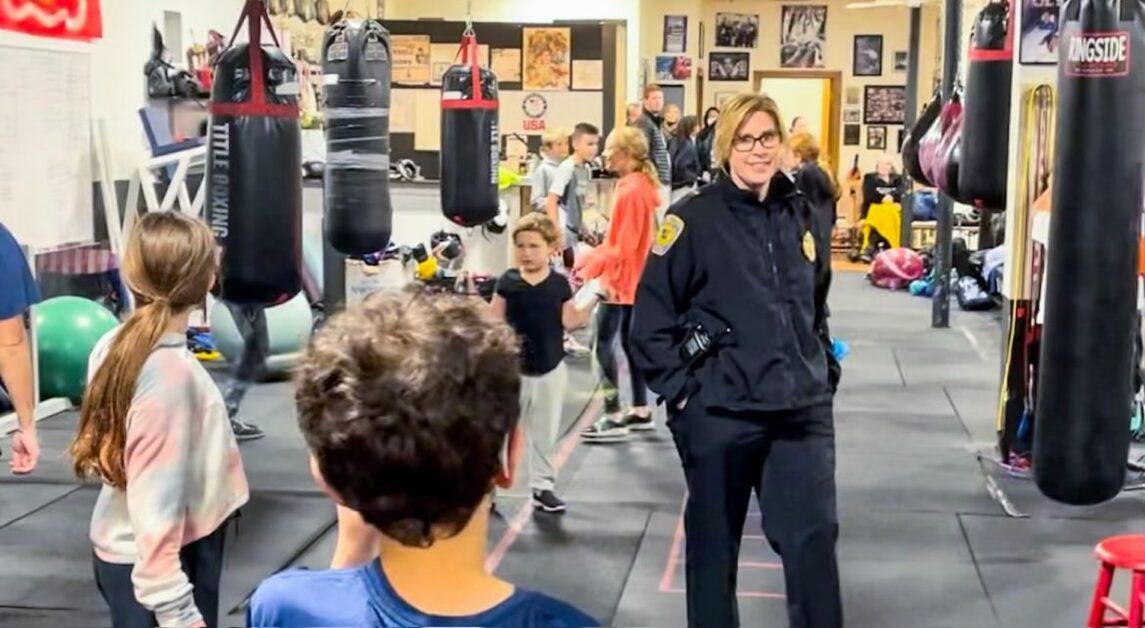 The afterschool program brings together students, boxing coaches, and police officers to offer self-defense lessons and build relationships between young residents and law enforcement. (Photo Courtesy of Nonantum Boxing Club)