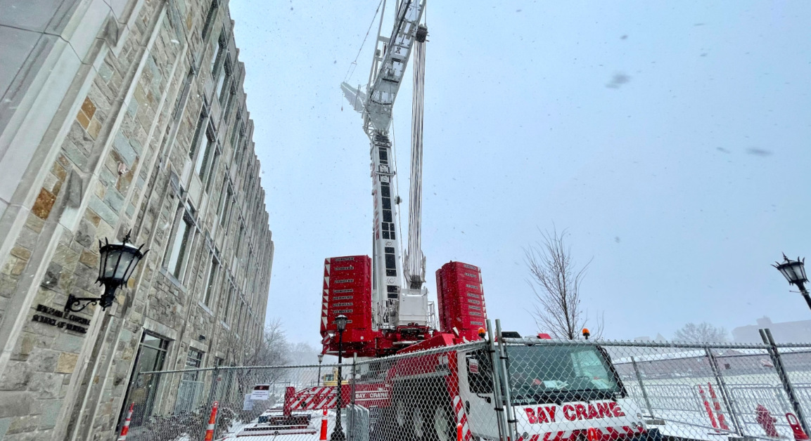 The crane will be in front of Maloney Hall through Friday, as detailed in an email sent to students on Friday, 1/20. (Nicole Vagra / Heights Editor)