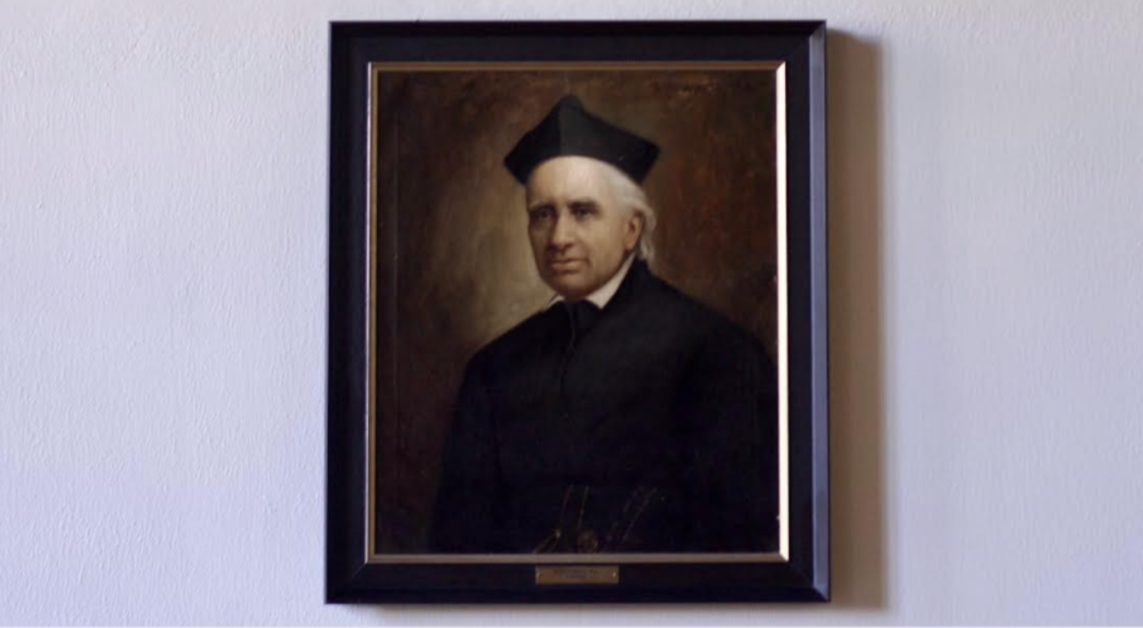 Portrait of John McElroy, S.J., in Gasson Hall (Nicole Vagra / Heights Editor)