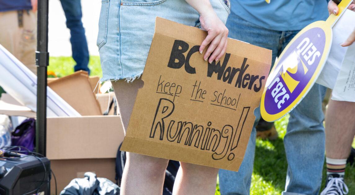 Employees, students, faculty, and community members gathered across from St. Ignatius Church Wednesday afternoon to call on Boston College to raise wages and increase training funds for facilities workers amid ongoing contract negotiations. 