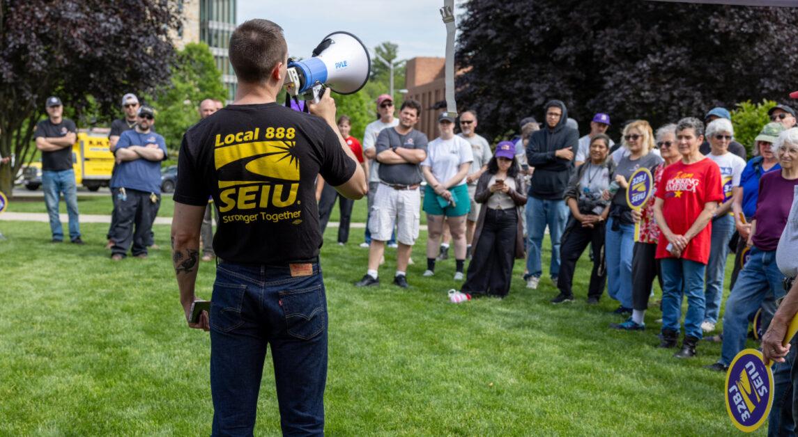 Boston College facilities workers rallied for higher wages and free skills training as union contract talks continue, with a potential strike looming if no agreement is reached by June 30.